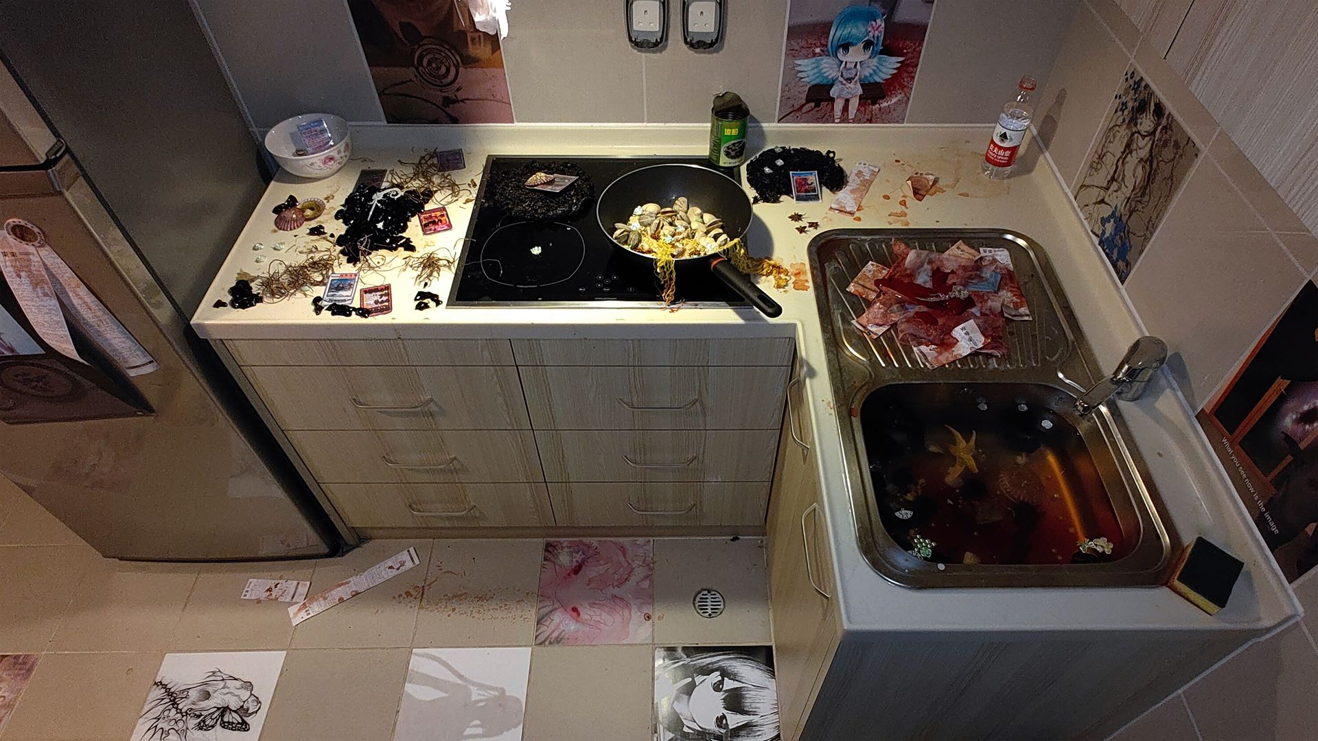 bird eye view of kitchen sink and floor. a lot of bloody elements on kitchen counter + sink and bloody supermarket receipts on floor